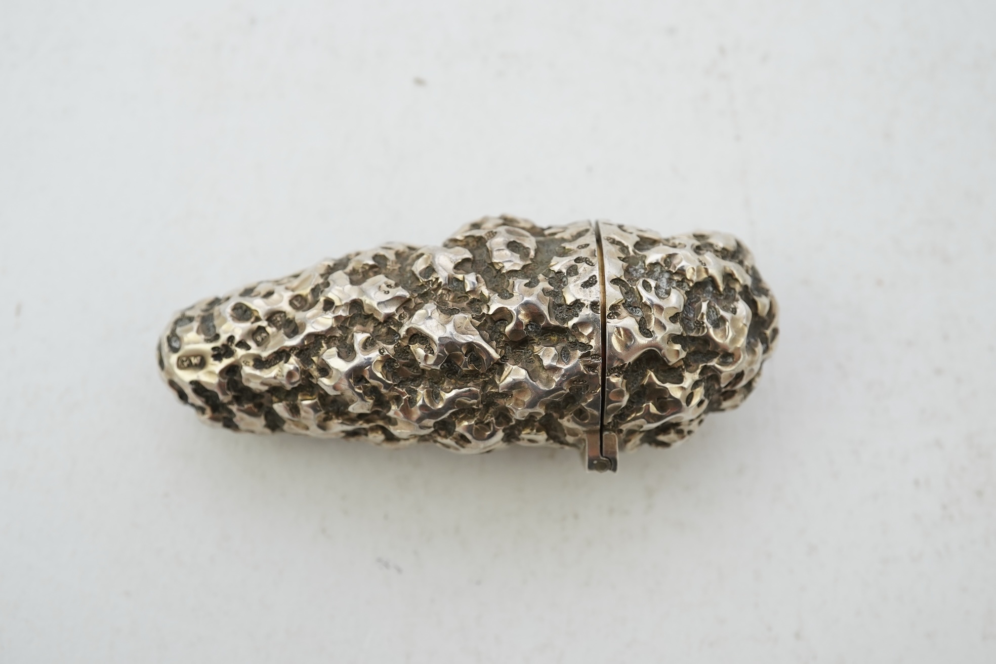 A late Victorian novelty silver scent flask, modelled as a 'gold nugget' by George Ward